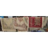 Four similar small Chinese wash rugs  various sizes