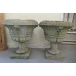 A pair of composition stone pedestal planters, on square plinths  24"h
