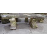 A composition stone terrace bench, the curved seat raised on two pedestals  17"h  57"w