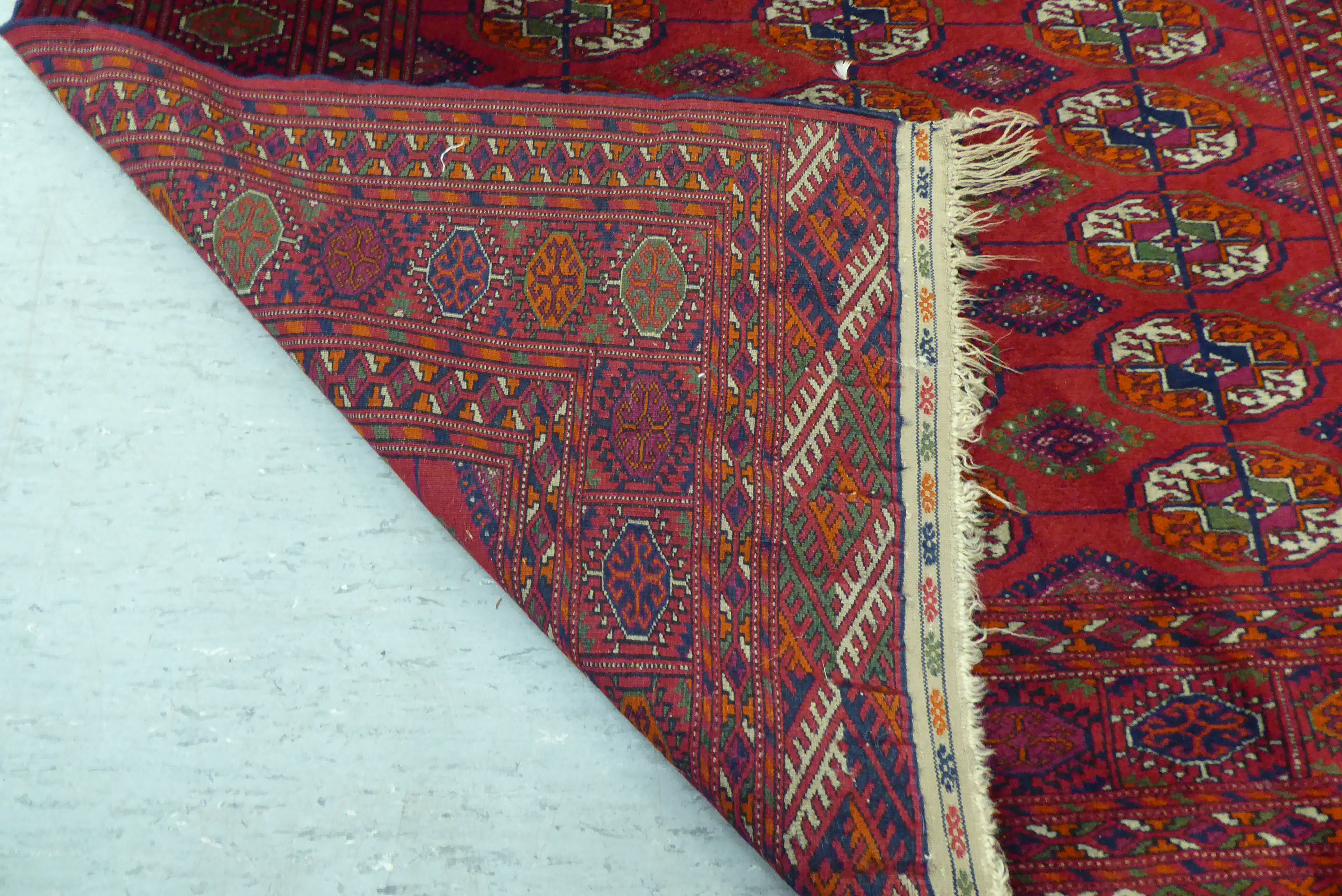 A Turkoman rug  39" x 58"; and another similar  46" x 66" each on a red ground - Image 4 of 5