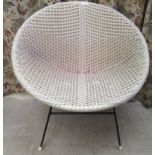 A vintage design wicker effect tub chair, on tubular metal legs