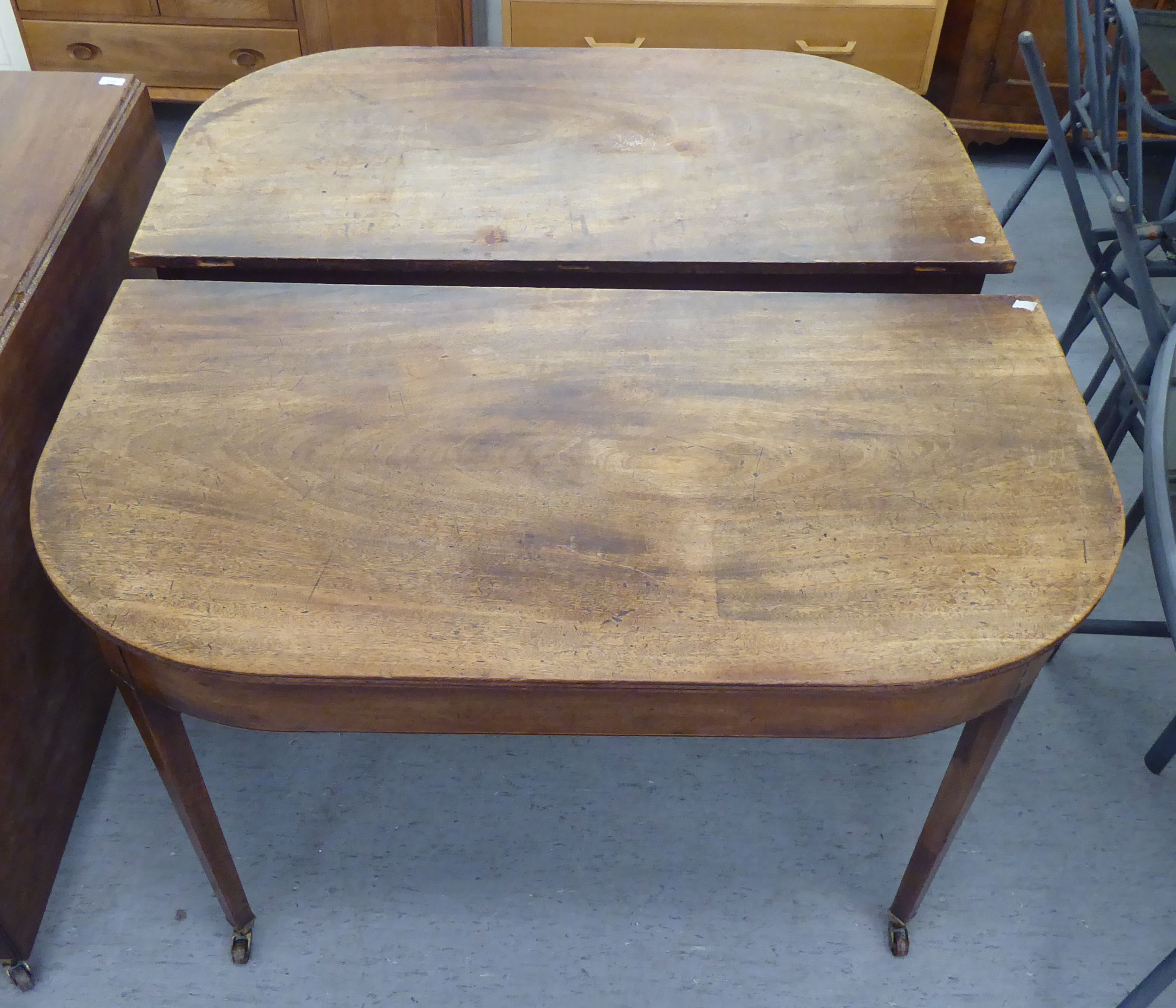 A George III mahogany dining table, comprising a drop leaf centre section and two D-ends, raised - Image 2 of 4