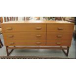 A G-Plan teak bedroom chest, comprising three long drawers and three adjacent shorter drawers,