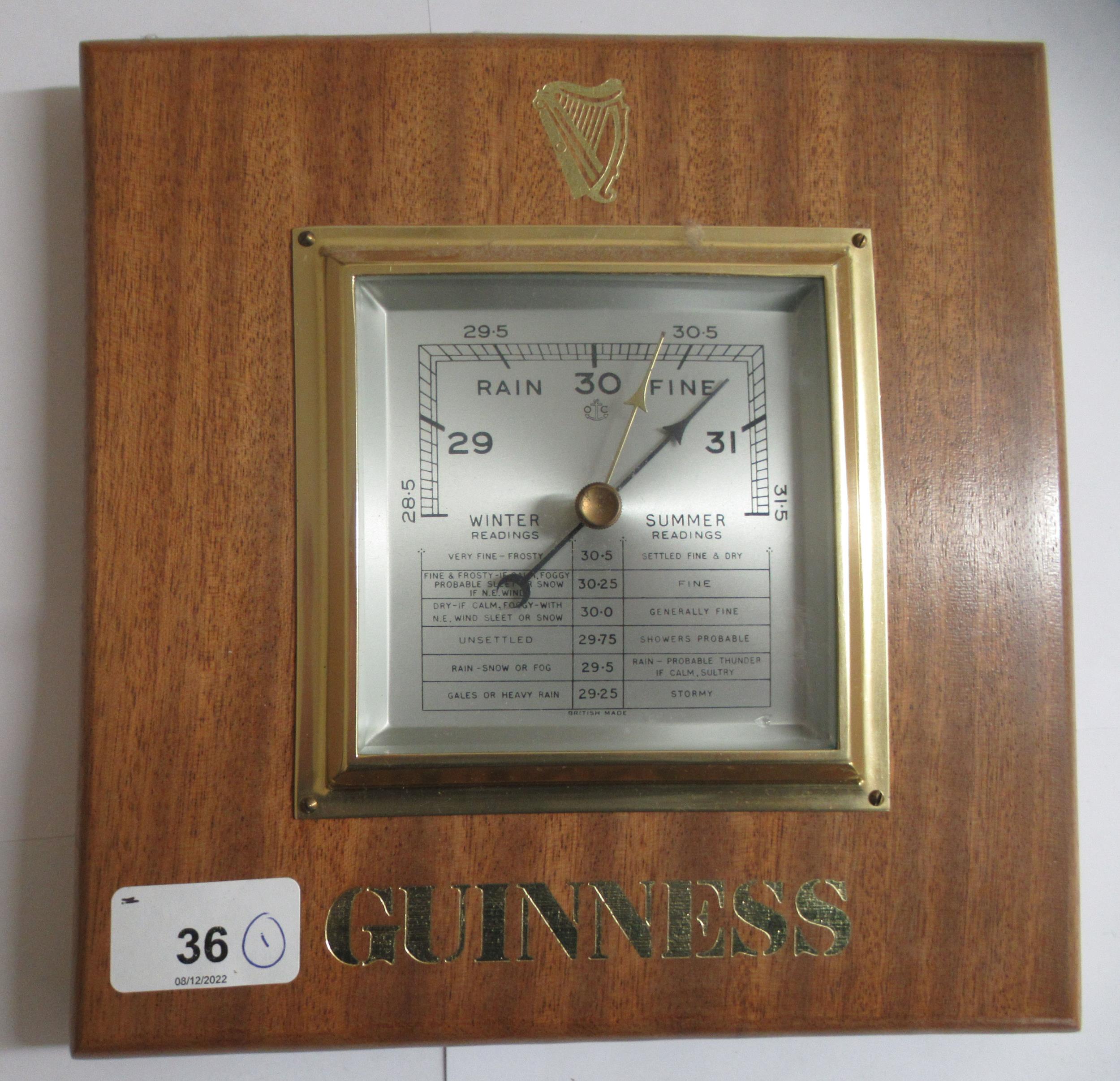 A modern mahogany framed barometer, branded for Guinness, faced by a steel dial  9"sq