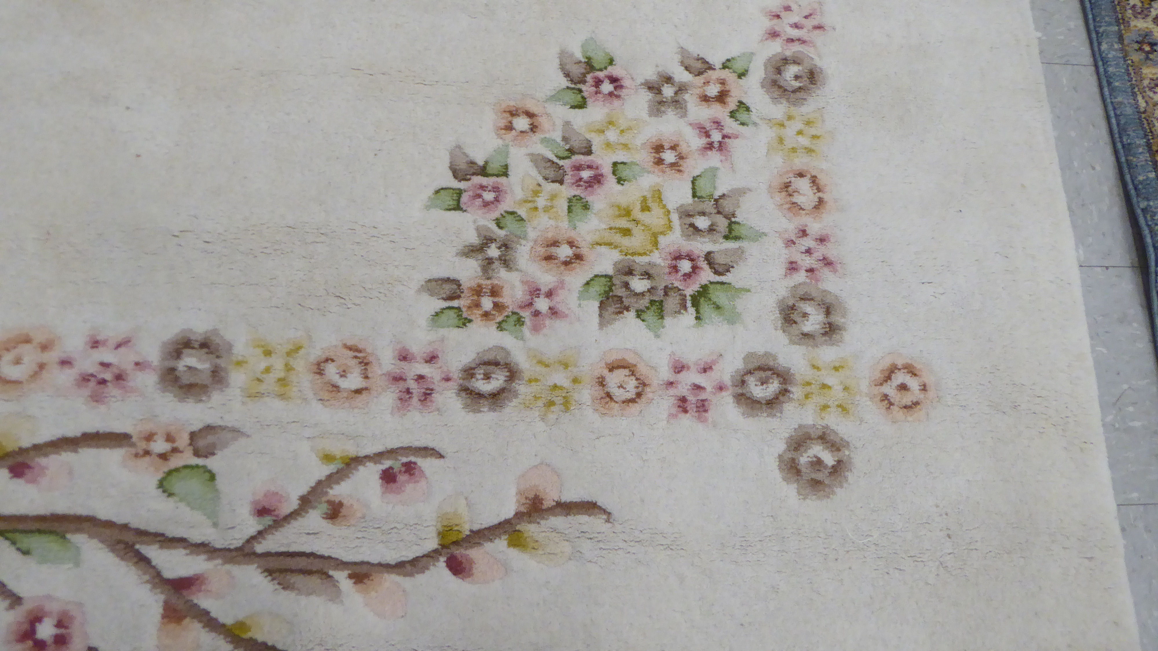 A modern woollen rug, decorated with flora, on a cream coloured ground  74" x 92" - Image 3 of 3