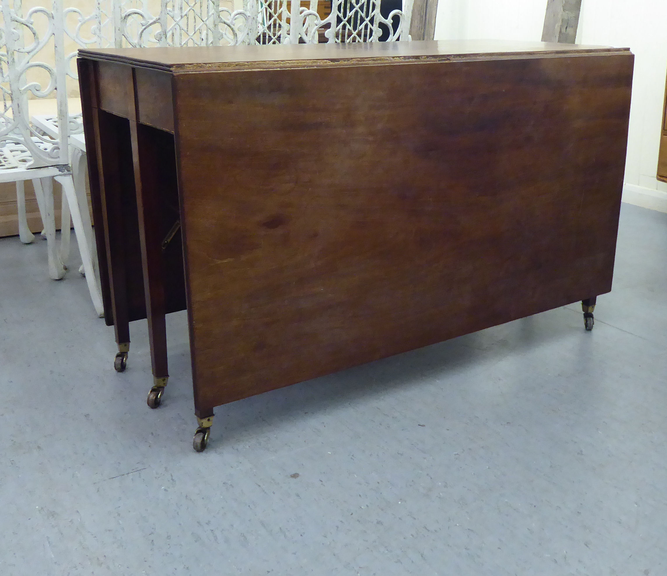 A George III mahogany dining table, comprising a drop leaf centre section and two D-ends, raised - Image 3 of 4