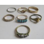 Seven rings: to include a gold coloured example, set with five turquoise beads; and a 9ct gold