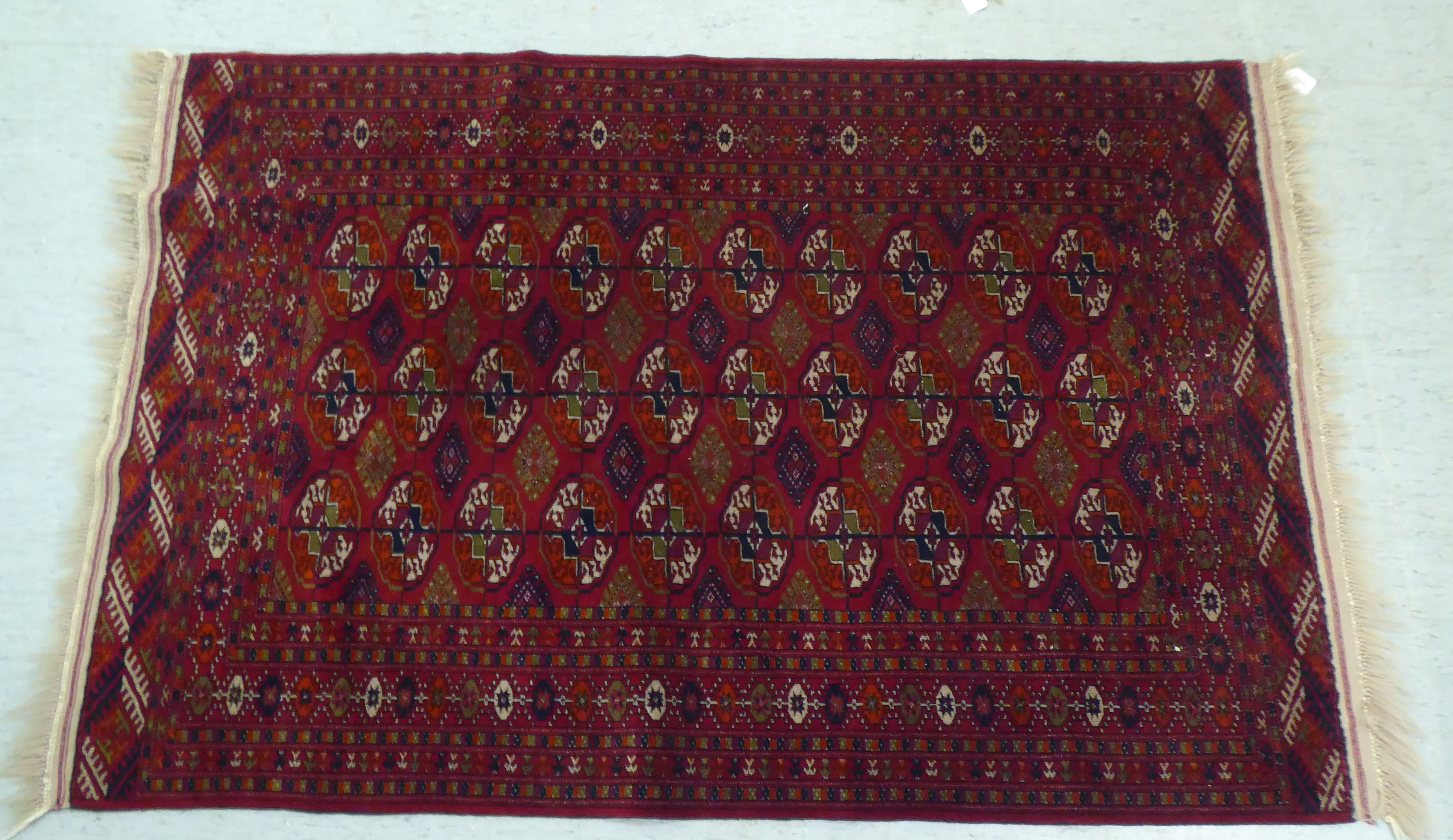 A Turkoman rug  39" x 58"; and another similar  46" x 66" each on a red ground - Image 2 of 5