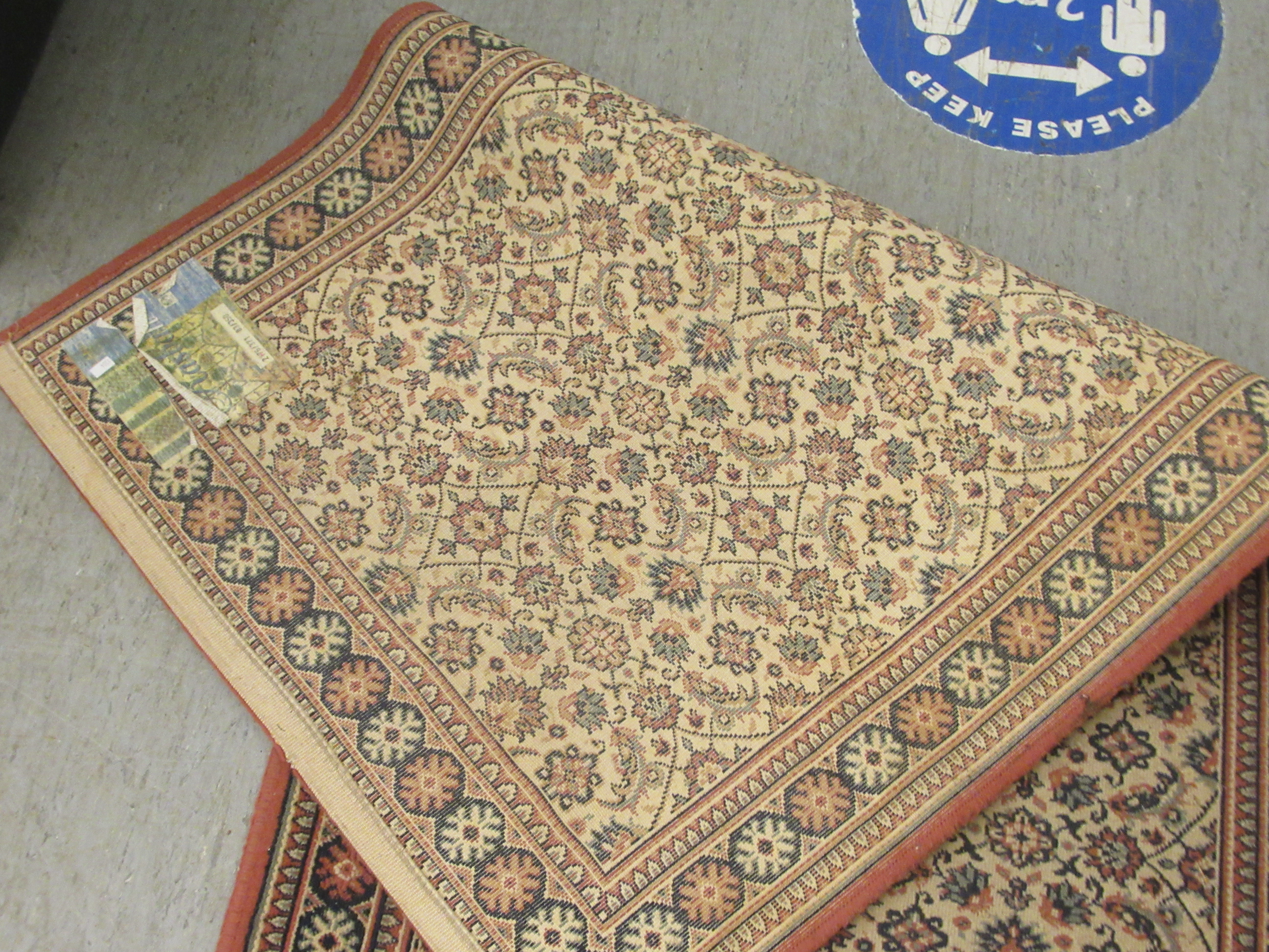 A machine made Persian design runner, decorated with repeating floral designs, on a multi-coloured - Image 5 of 5