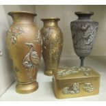20thC Asian metalware: to include a pair of Japanese bronze vases, decorated in relief with birds