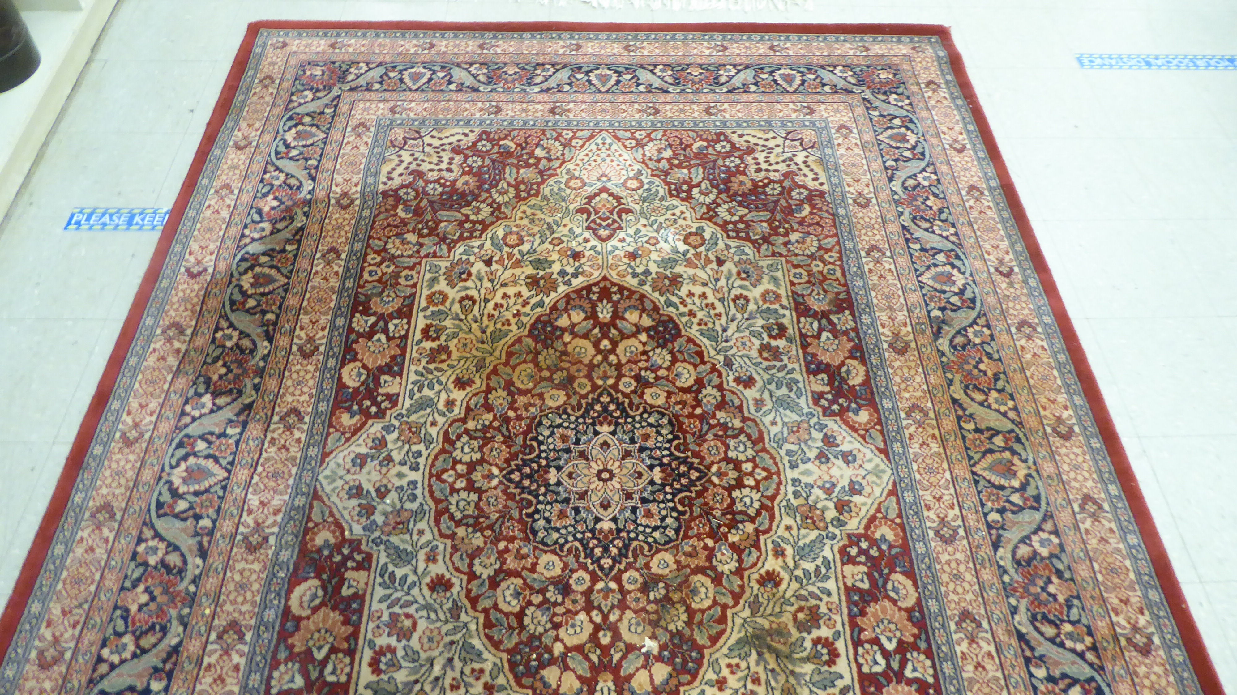 A modern Persian design machine made rug, decorated with flora in bright colours, on a red ground - Image 2 of 4