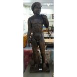 A carved and stained wood statue, a standing male nude  36"h