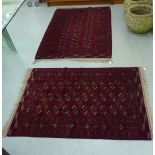 A Turkoman rug  39" x 58"; and another similar  46" x 66" each on a red ground