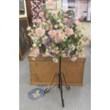 A faux floral display, on a wrought metal stand  52"h