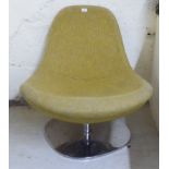 A modern vintage design fabric upholstered, high back bucket chair, raised on a rotating chromium