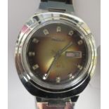 A vintage Ricoh automatic stainless steel cased bracelet watch, faced by a shaded brown baton dial