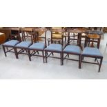 A set of six Regency mahogany framed bar back dining chairs with drop-in seats, raised on square,