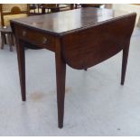 A 19thC mahogany Pembroke table, the oval top with a reed carved edge, over an end drawer and