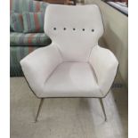 A mid 20thC design office reception chair, upholstered in black and white hide, raised on tapered,