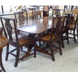 A 19thC Regency design mahogany dining table, the top with a reeded edge, having two D-ends and an