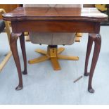 A George III mahogany games table, the foldover top with turret corners and carved coin/token