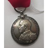 A George V Naval Reserve Long Service and Good Conduct medal, indistinctly, inscribed '....