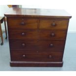 A late Victorian mahogany dressing chest, comprising two short/three long drawers with bun