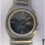 A vintage Lanco automatic stainless steel cased bracelet watch, faced by a baton dial with day &