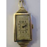 A ladies 9ct gold cased bracelet watch, faced by a rectangular Arabic dial