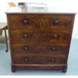 A late Victorian mahogany dressing chest, comprising two short/three long drawers with bun