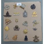 Twenty regimental cap badges and other insignia: to include Queens Own Yeomanry, Royal Home