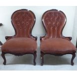 A pair of modern Victorian style carved mahogany framed waisted spoonback salon chairs, part