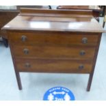 An early 20thC mahogany washstand with three drawers, raised on chamfered, square legs  30"h  34"w