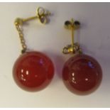 A pair of 9ct gold chain link cornelian, ball drop earrings