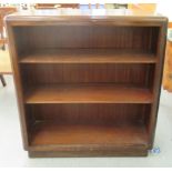A 20thC mahogany open front two tier bookcase, on a plinth  40"h  36"w