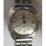 A vintage Waltham Beatmaster automatic stainless steel cased bracelet watch, faced by a white