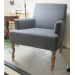 A modern enclosed armchair with a level back, stud upholstered in grey fabric, raised on baluster