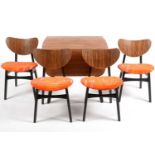 G-Plan: a 'Librenza' tola wood and black lacquered drop leaf table and four dining chairs.