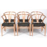 Six modern CH25 style beech and black cord wishbone chairs .