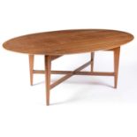 An unusual 1950's oval walnut dining/boardroom table, possibly Morris & Co or Everest.