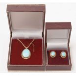 An opal pendant and earrings,