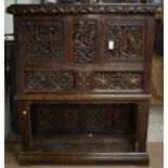 A substantial ornate oak carved cupboard