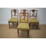 Four Edwardian carved walnut dining chairs