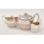 A three piece silver tea service