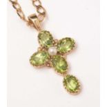 A peridot and cultured pearl set crucifix pendant,