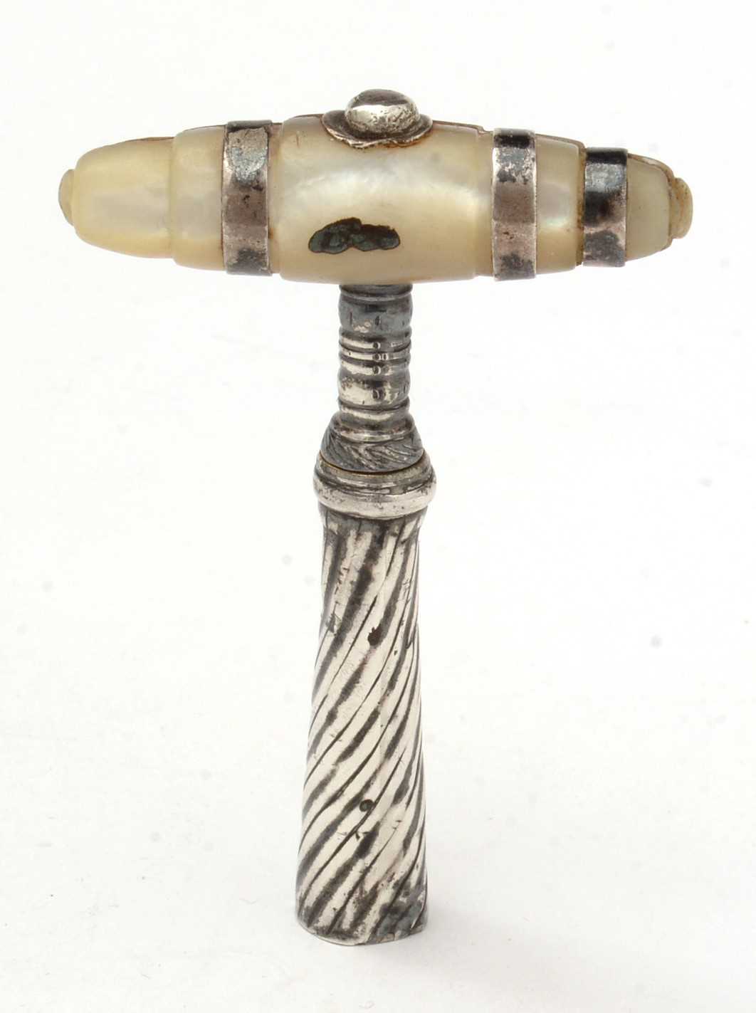 A Georgian white-metal pocket corkscrew.