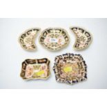 Five Royal Crown Derby Imari palette dishes.