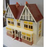 A two-storey half-timbered doll's townhouse.