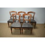 Five Victorian carved mahogany balloon back dining chairs with foliate design