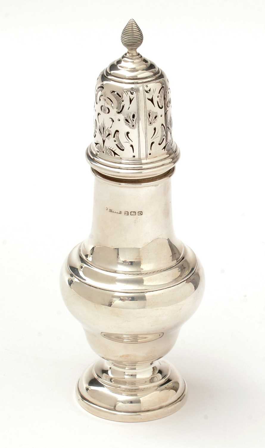 A George V silver sugar caster.